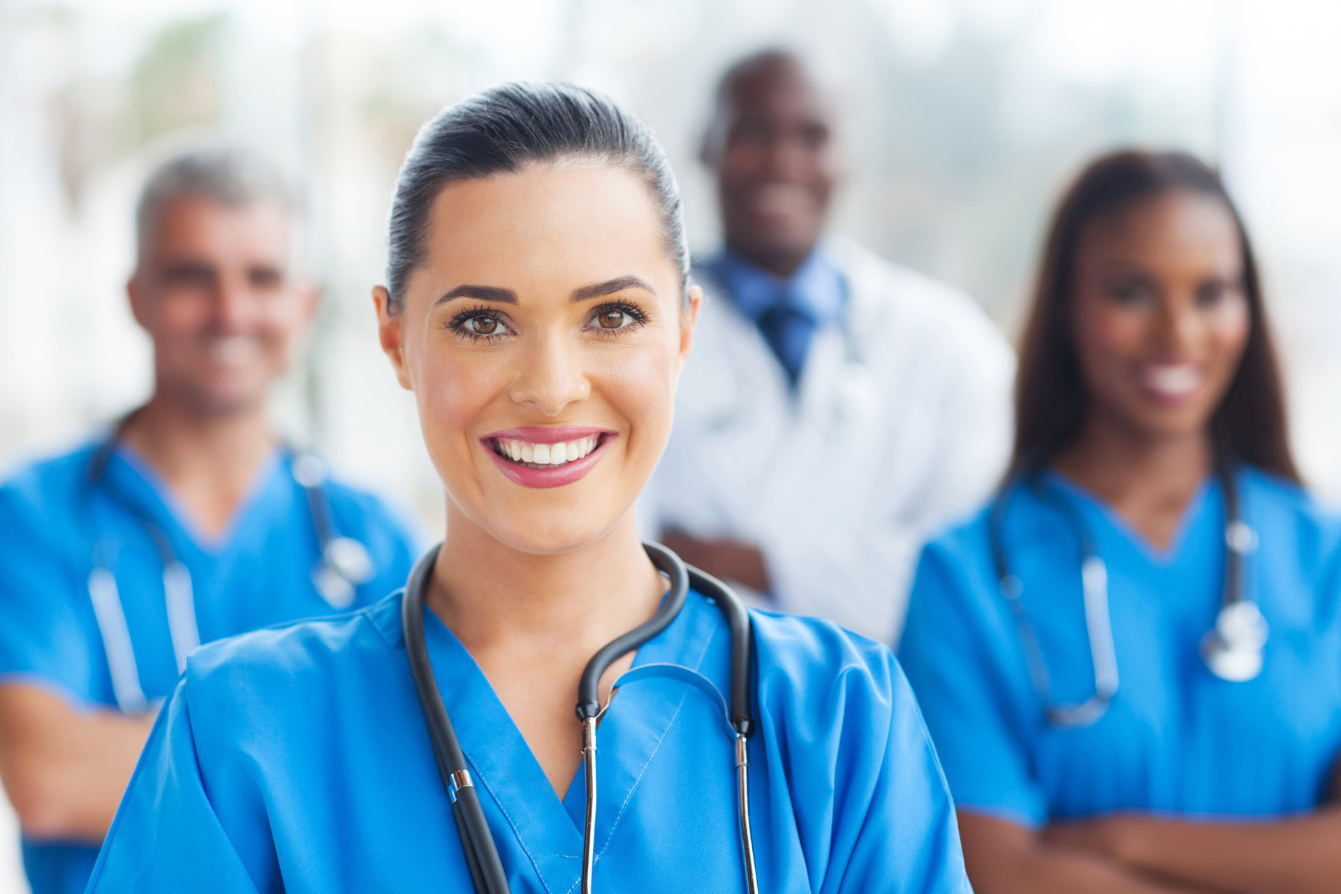 beautiful medical nurse and colleagues in hospital